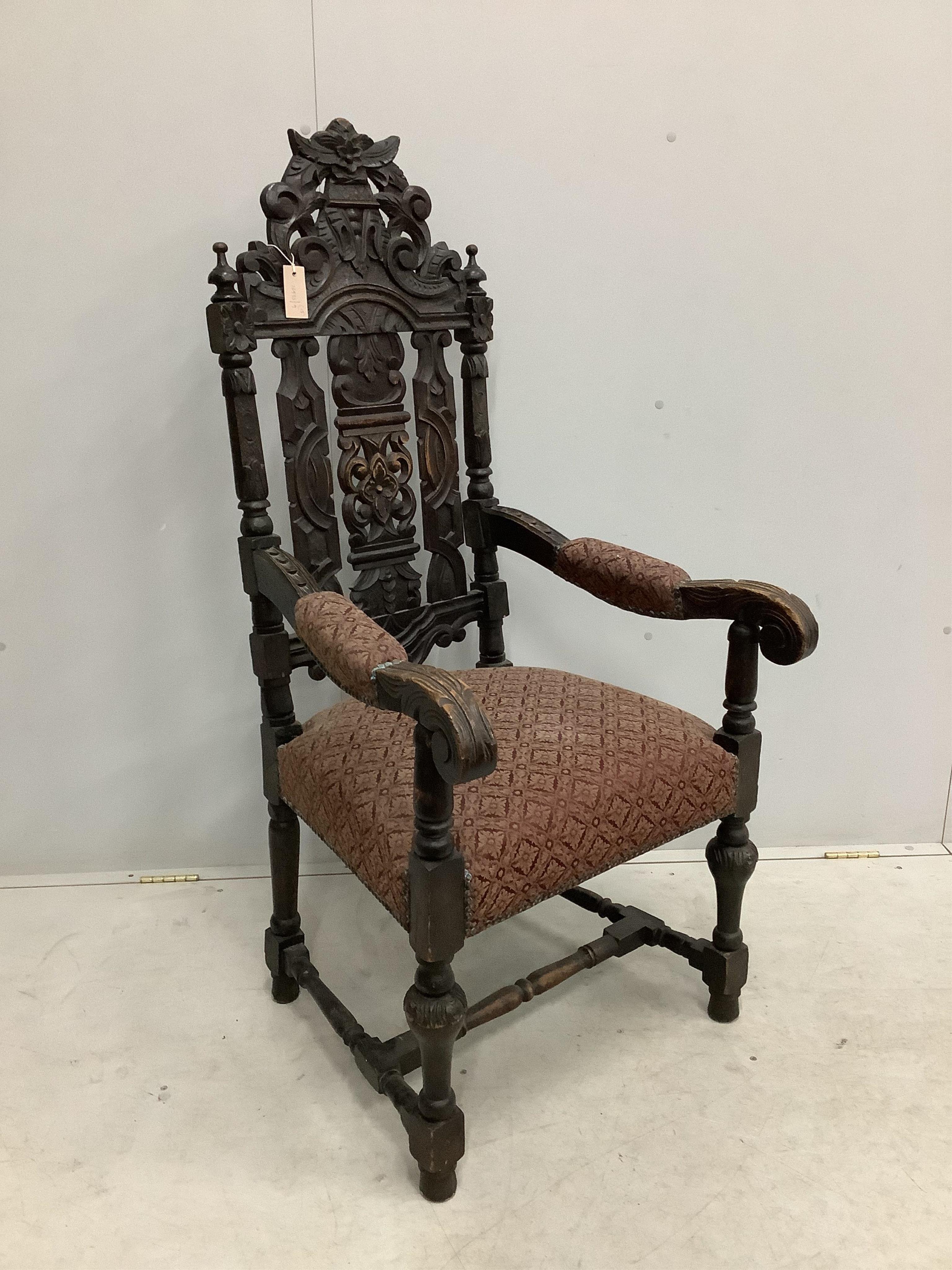 A set of thirteen carved Victorian oak dining chairs, one with arms. Condition - poor to fair